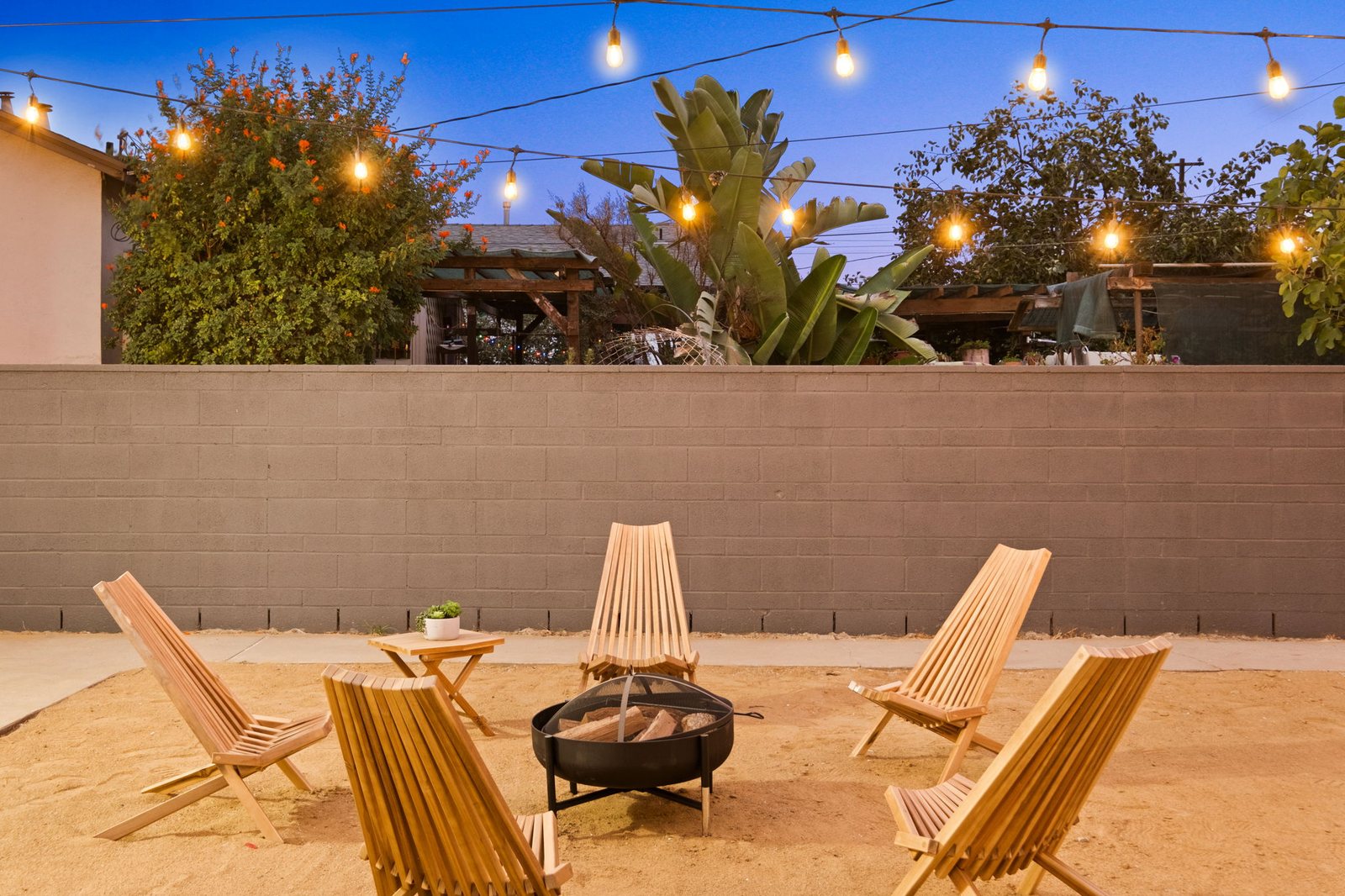 Gale Avenue backyard fire pit at dusk