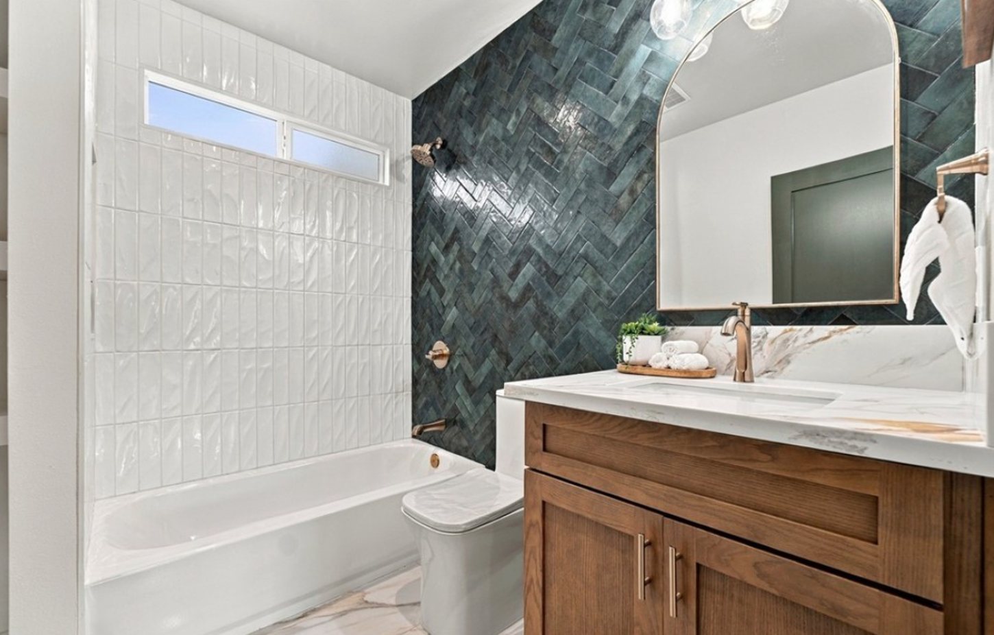 7th Street emerald herringbone bath